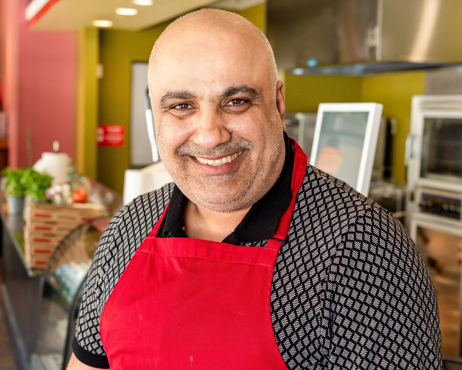 Omar, owner of Nino's Italian Delight Pizza Express